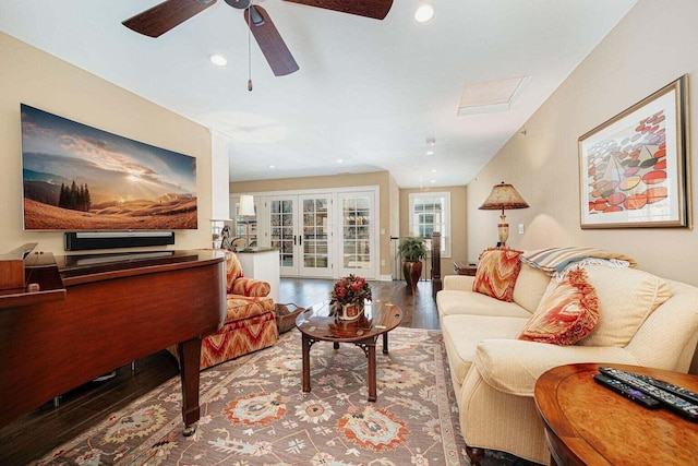 living room with wood-type flooring, french doors, and ceiling fan