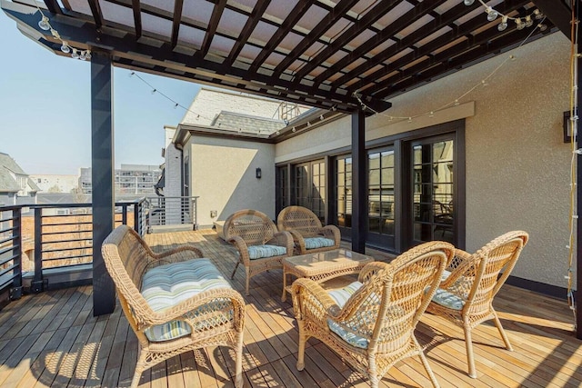 wooden terrace featuring outdoor lounge area