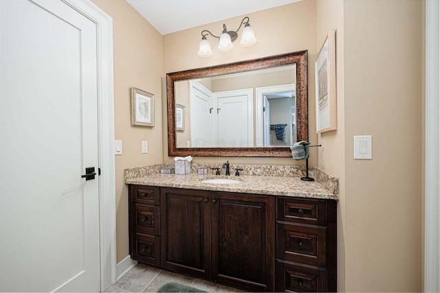 bathroom with tile patterned flooring and vanity