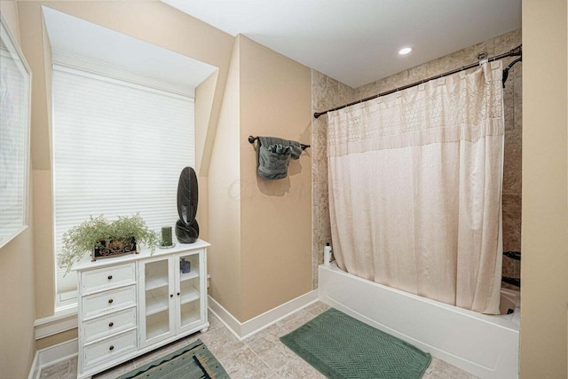 bathroom featuring tile patterned floors and shower / bathtub combination with curtain