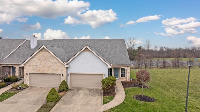 view of front of house with a garage and a front yard