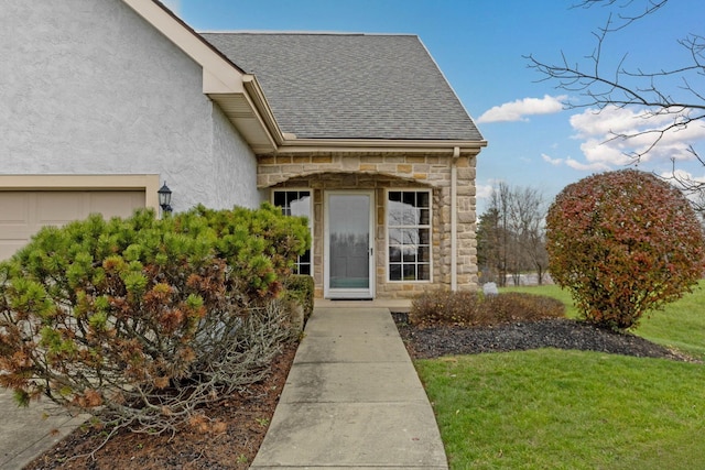 entrance to property with a yard