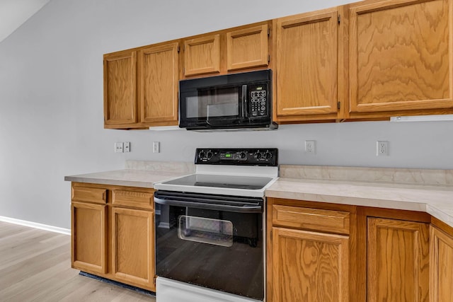 kitchen featuring light hardwood / wood-style floors and electric stove