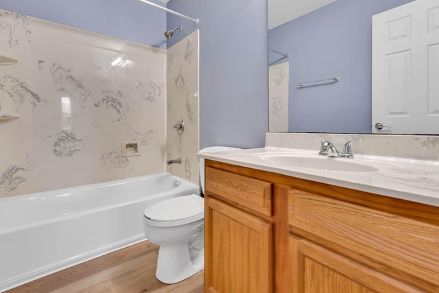 full bathroom with toilet, vanity, shower / bathtub combination, and hardwood / wood-style flooring