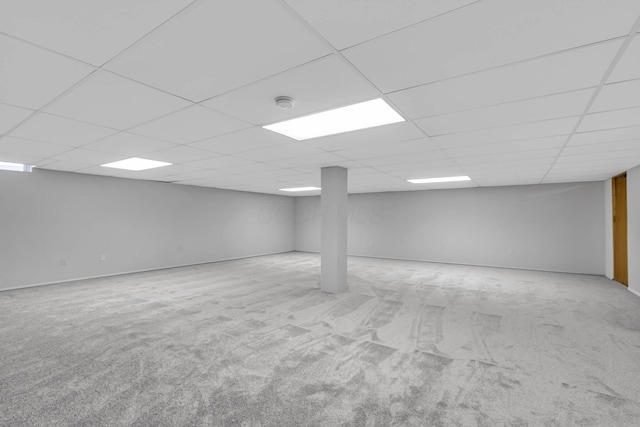 basement featuring light colored carpet