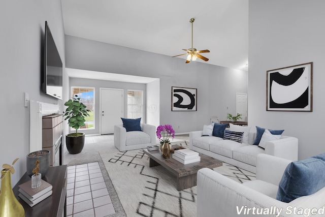 carpeted living room with ceiling fan