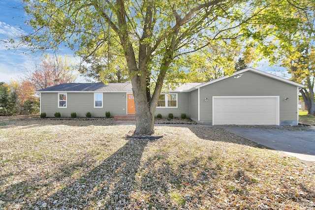 single story home with a garage