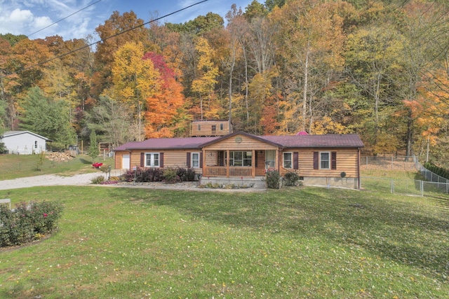 view of front of home with a porch and a front yard