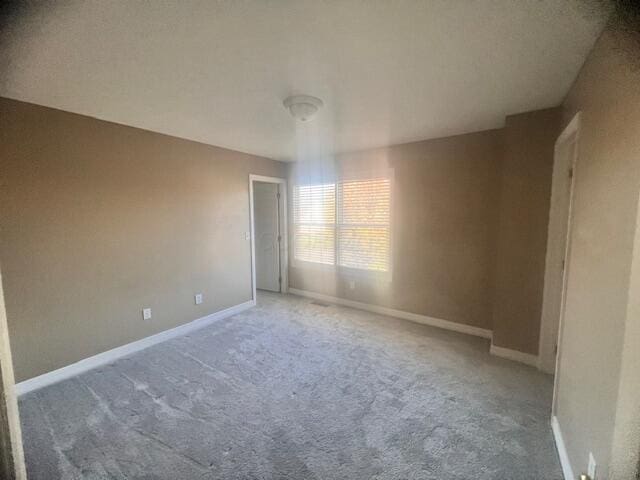 spare room with carpet floors