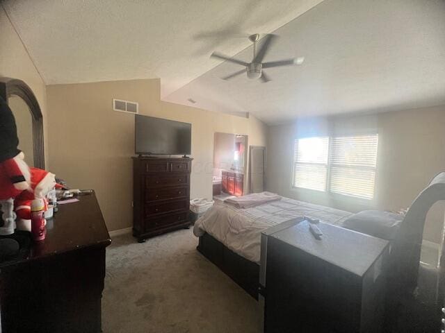 carpeted bedroom with ceiling fan and lofted ceiling