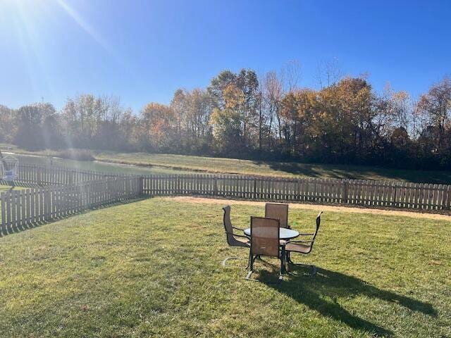 view of yard with a rural view