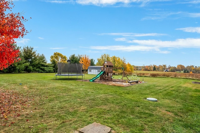 view of jungle gym with a yard and a trampoline