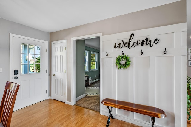 entrance foyer with light hardwood / wood-style flooring and plenty of natural light