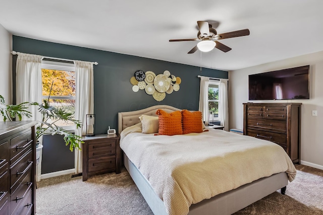 carpeted bedroom featuring ceiling fan