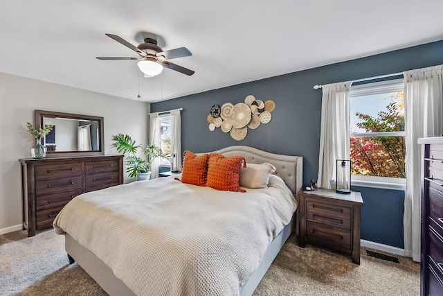 carpeted bedroom with ceiling fan