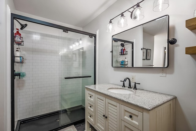 bathroom with vanity and an enclosed shower