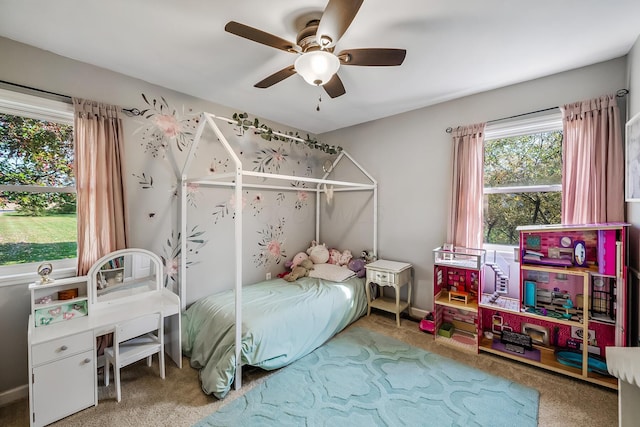 carpeted bedroom with ceiling fan