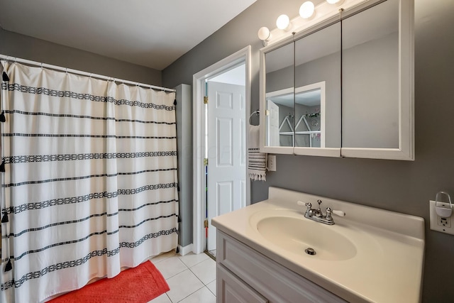 bathroom featuring tile patterned flooring and vanity