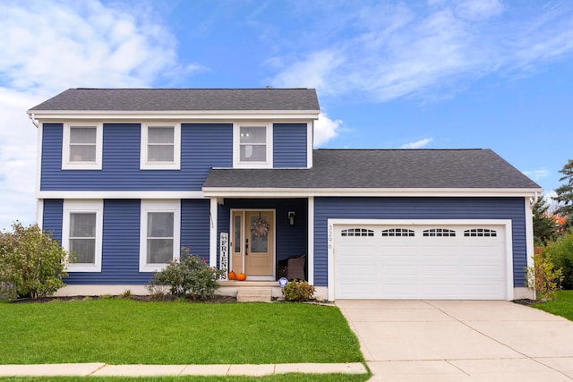 front facade featuring a garage and a front yard