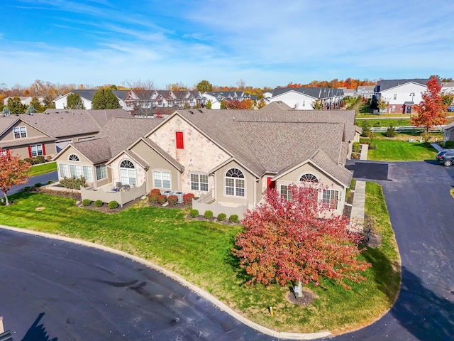 single story home featuring a front yard