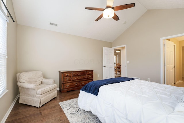 bedroom with vaulted ceiling, ceiling fan, and dark hardwood / wood-style flooring