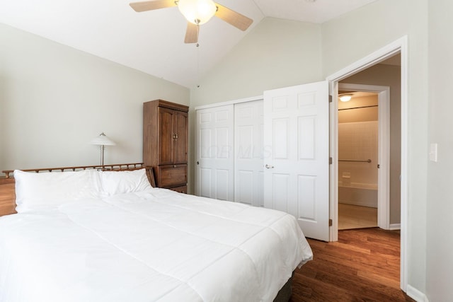 bedroom featuring lofted ceiling, ceiling fan, dark hardwood / wood-style flooring, and a closet