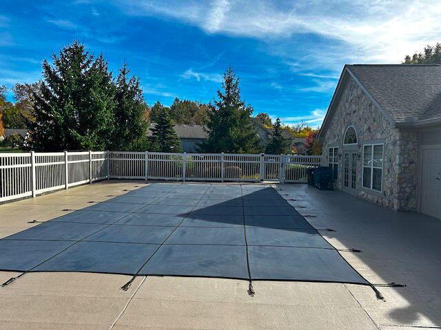 view of swimming pool with a patio area