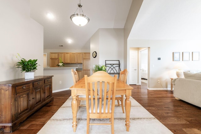 dining room with dark wood-type flooring