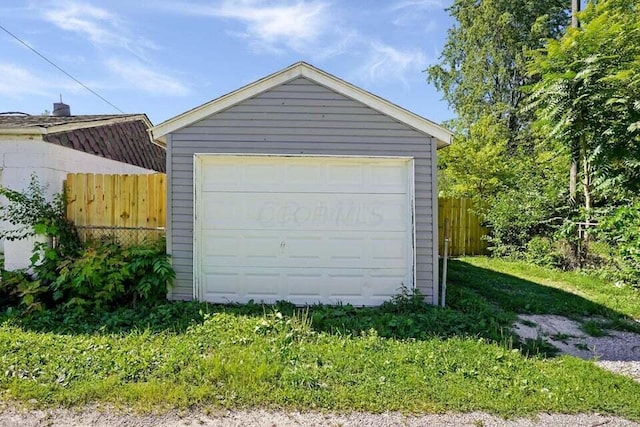 garage featuring a lawn