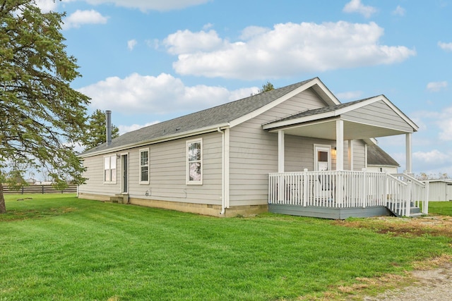 exterior space featuring a deck and a front lawn