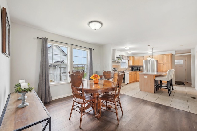 dining space featuring light hardwood / wood-style floors