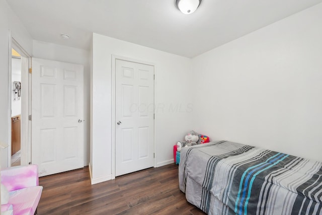 bedroom featuring dark hardwood / wood-style floors