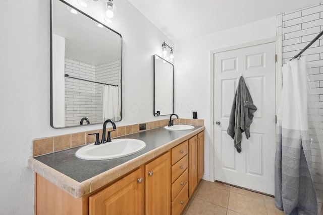 bathroom featuring tile patterned flooring and vanity