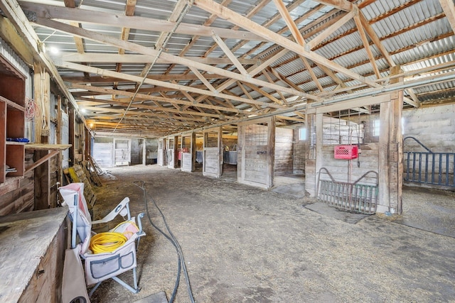 miscellaneous room with a healthy amount of sunlight and lofted ceiling