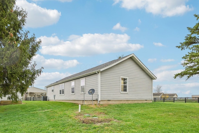 view of home's exterior featuring a yard