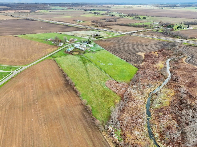 birds eye view of property with a rural view