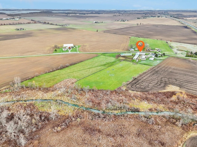 birds eye view of property with a rural view