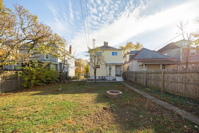 view of yard with a fire pit