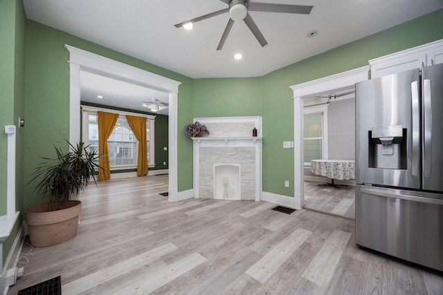 kitchen featuring light hardwood / wood-style floors, white cabinetry, and stainless steel fridge with ice dispenser