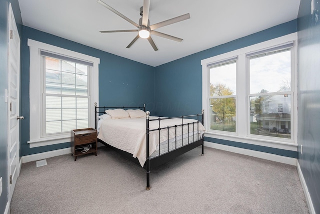 bedroom with ceiling fan and carpet