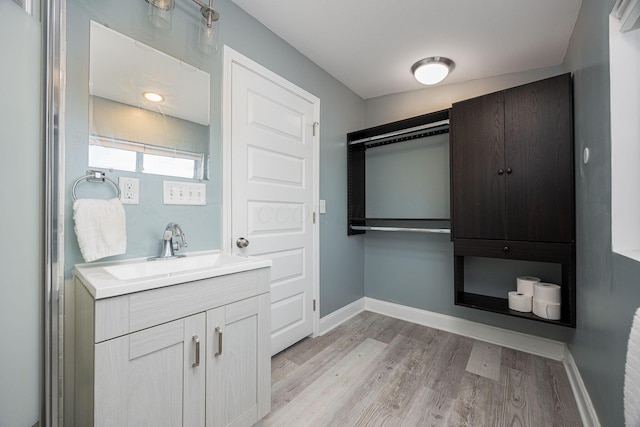 bathroom featuring vanity and hardwood / wood-style flooring