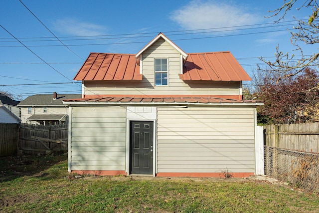 view of outdoor structure with a lawn