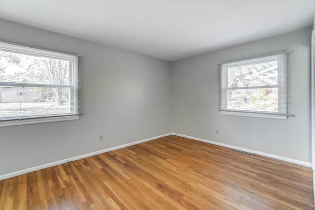 empty room featuring hardwood / wood-style floors