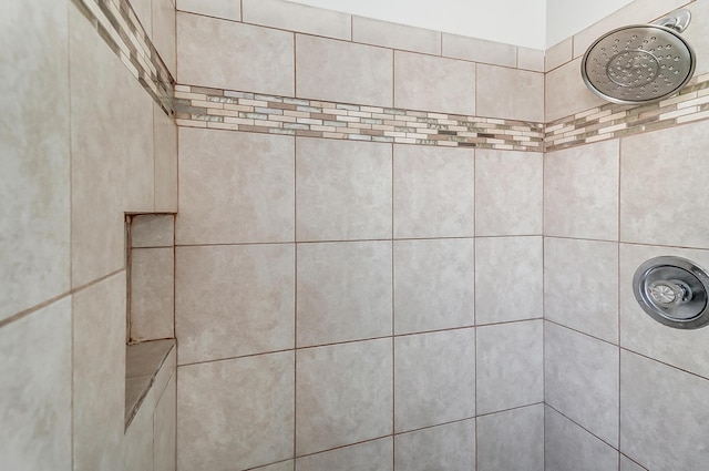 details featuring a tile shower