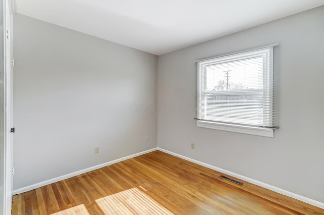 empty room featuring wood-type flooring