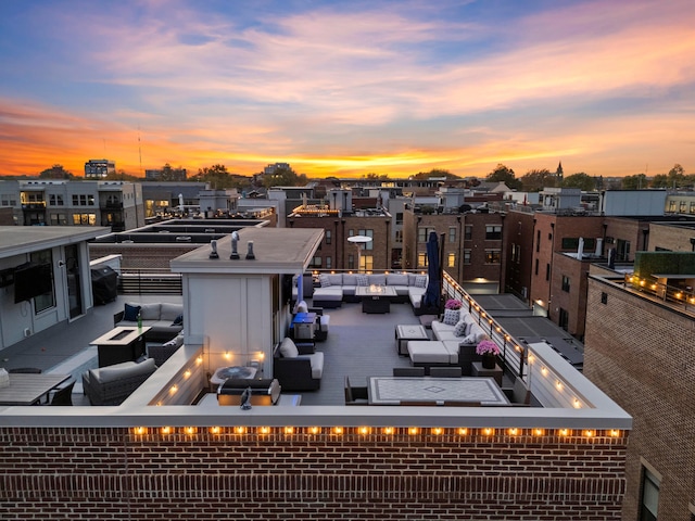 exterior space with an outdoor living space with a fire pit