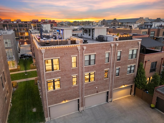 view of outdoor building at dusk