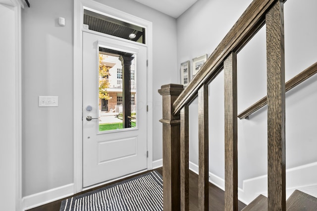 entrance foyer with dark hardwood / wood-style floors