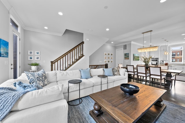 living room featuring dark hardwood / wood-style flooring and crown molding