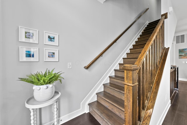 staircase featuring wood-type flooring